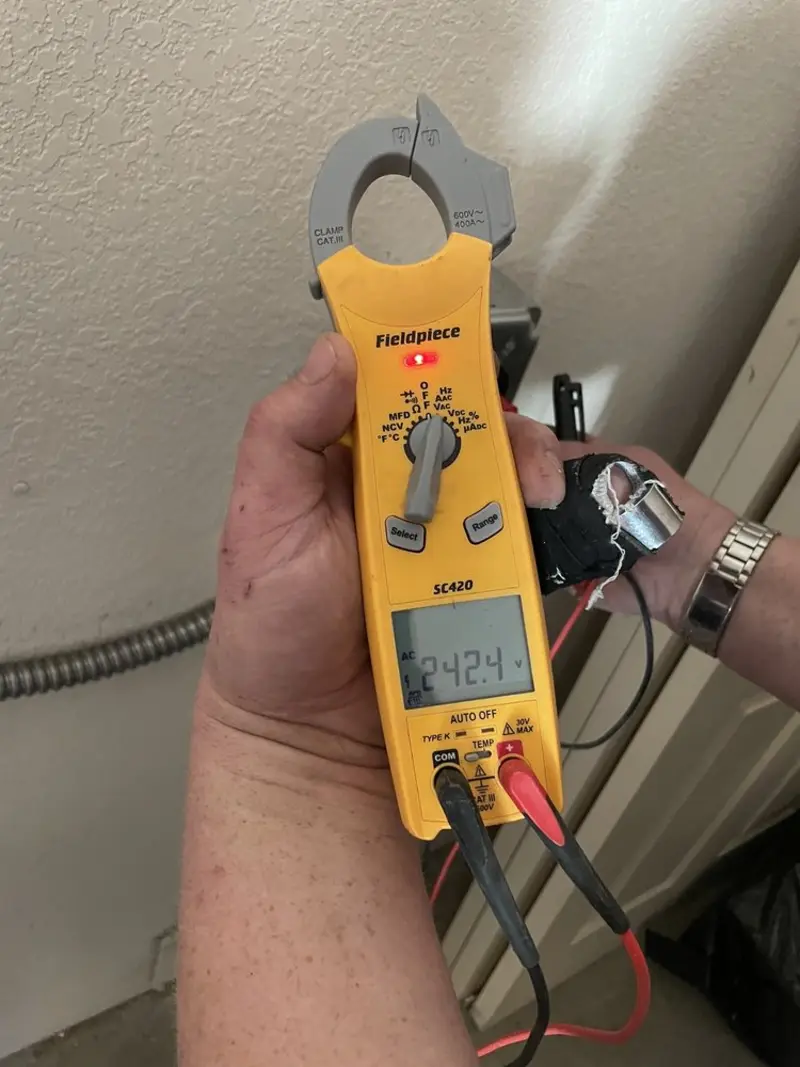 Voltage testing with clamp meter during Ceiling Fan Installation in Monfort Heights